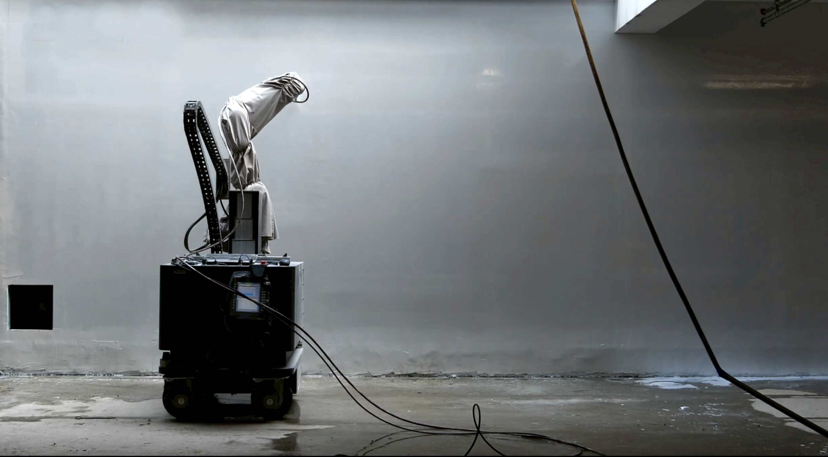 ROSO construction robot positioned in front of a finished interior wall.