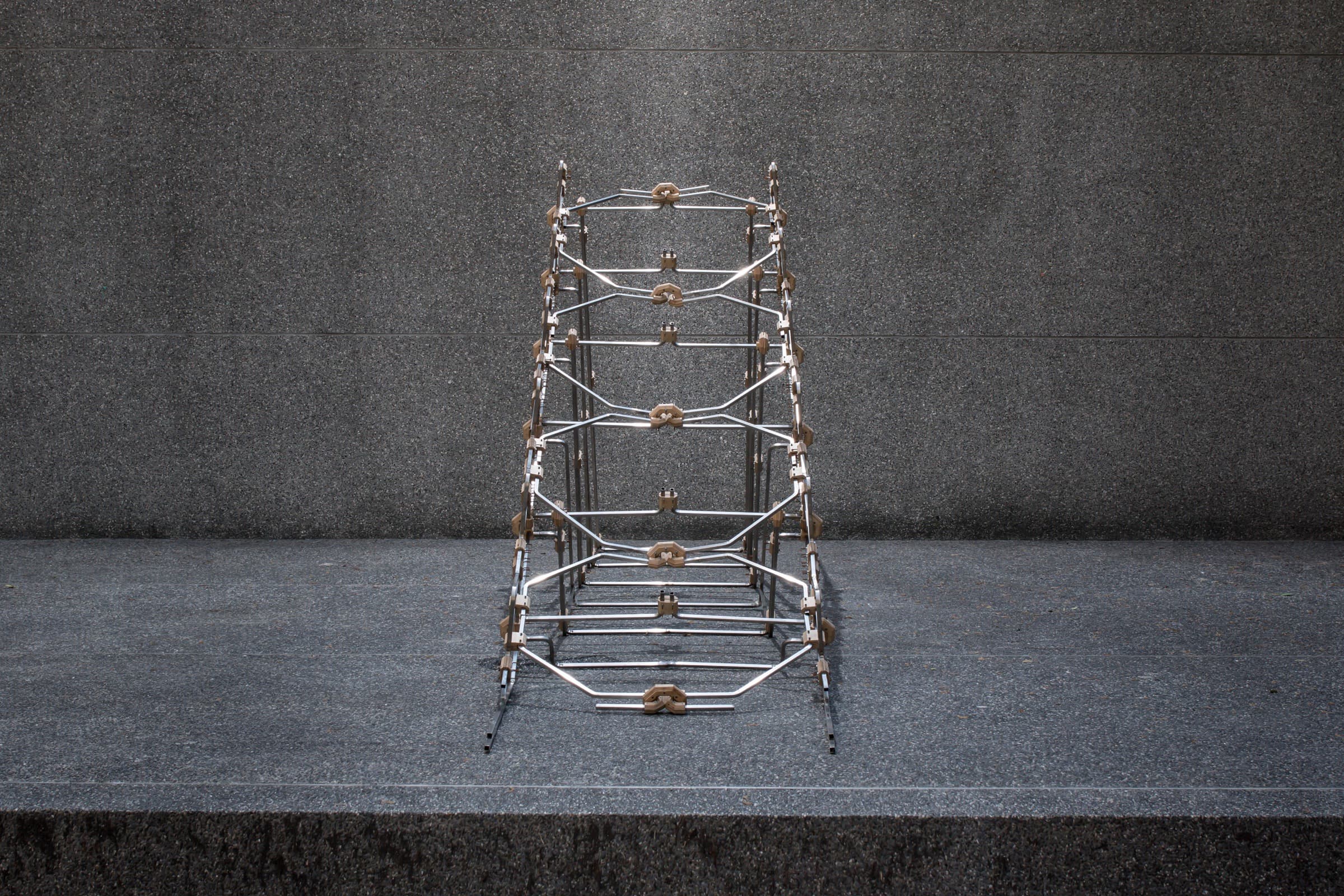 Bent-tube structure with interlocking joints, assembled at full scale.