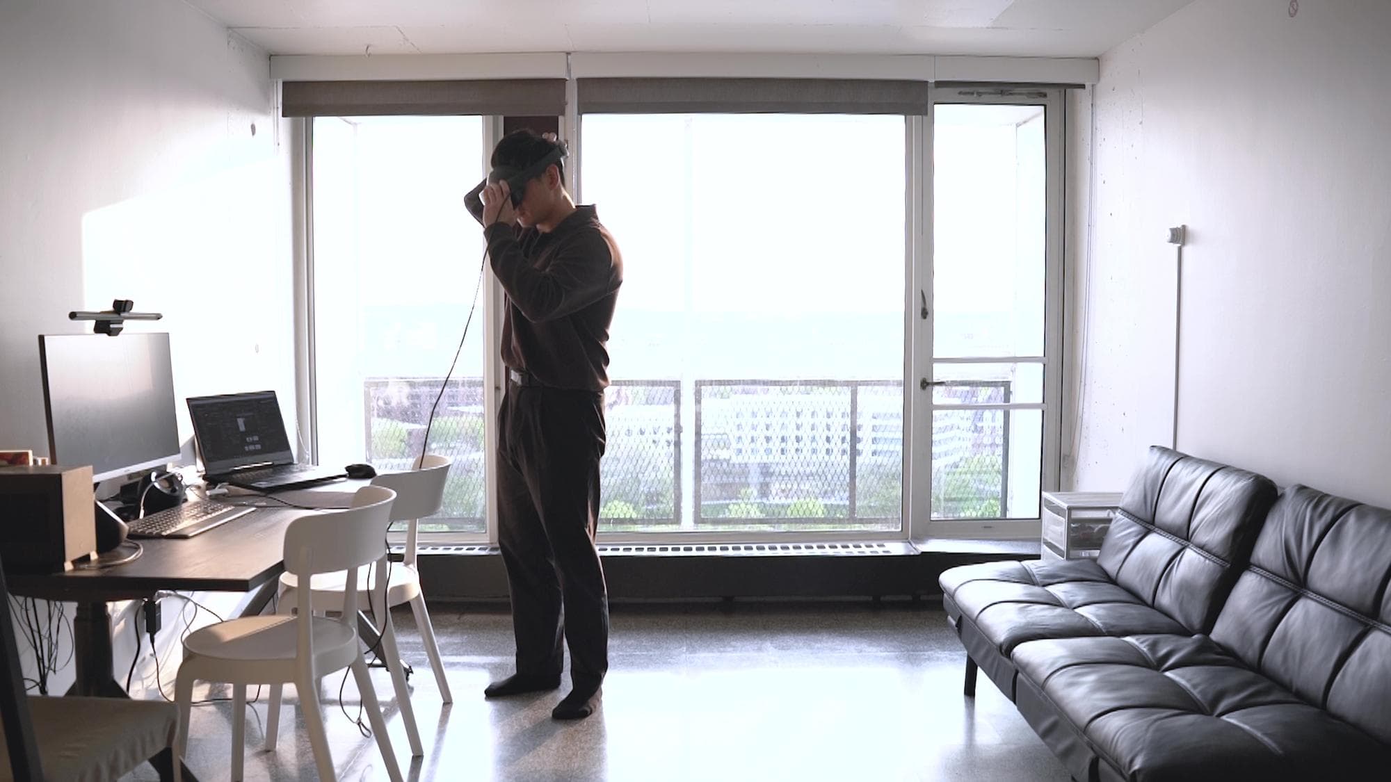 User testing the Anthroposense VR prototype in the scanned room.