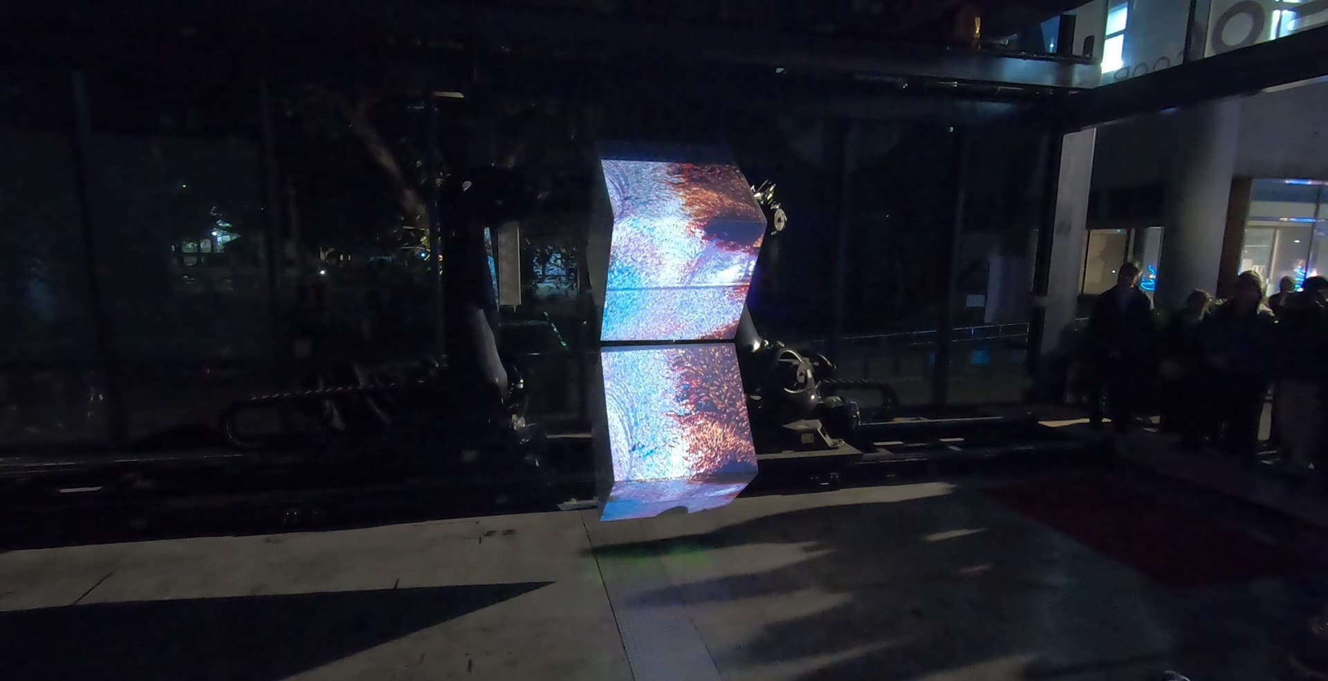 Robot Cube live performance showing a mapped cube held by the robotic arm.